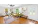 Inviting living room showcasing hardwood floors, natural light from large windows, and stylish decor at 2919 Dunaire Dr, Charlotte, NC 28205