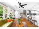 Stylish living space with hardwood floors, large windows, and an open layout connecting the kitchen and living area at 2919 Dunaire Dr, Charlotte, NC 28205