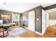 Well-lit office space with hardwood floors, modern barn door, and a large window at 2919 Dunaire Dr, Charlotte, NC 28205