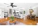 Open-concept kitchen and living space with a large island, dining area, and hardwood floors at 2919 Dunaire Dr, Charlotte, NC 28205