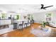 Open-concept kitchen and living area with stainless steel appliances, a large island, and hardwood floors at 2919 Dunaire Dr, Charlotte, NC 28205