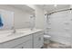 Modern bathroom featuring double sinks and a tub with shower at 331 Gaines Rd, Clover, SC 29710