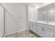 Bathroom featuring double sinks, tile flooring, and a large framed mirror at 331 Gaines Rd, Clover, SC 29710