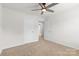 Spacious bedroom with a ceiling fan and a view into another room at 331 Gaines Rd, Clover, SC 29710