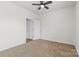 This bedroom has neutral walls, carpeted floors, ceiling fan and closet at 331 Gaines Rd, Clover, SC 29710