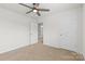 Bedroom with a ceiling fan and a view into the bathroom at 331 Gaines Rd, Clover, SC 29710