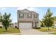 Charming two-story home with gray facade, a two-car garage, and well manicured front yard at 331 Gaines Rd, Clover, SC 29710
