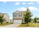 View of a home with gray siding, complemented by a green lawn and mature trees at 331 Gaines Rd, Clover, SC 29710