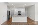 Modern kitchen with a large island, stainless steel appliances, and white cabinets at 331 Gaines Rd, Clover, SC 29710