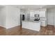 Bright kitchen featuring white cabinetry, granite countertops, and stainless steel appliances at 331 Gaines Rd, Clover, SC 29710