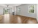 Light-filled living room featuring hardwood floors, a fireplace, and a sliding door to the backyard at 331 Gaines Rd, Clover, SC 29710