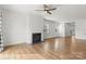 Open-concept living room with a fireplace, hardwood flooring, and natural light at 331 Gaines Rd, Clover, SC 29710