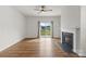 Living room featuring hardwood floors, gas fireplace, and sliding glass doors to yard at 331 Gaines Rd, Clover, SC 29710