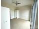 Bright bedroom with a ceiling fan and large windows at 333 W Trade St # 505, Charlotte, NC 28202