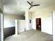 Spacious bedroom featuring a ceiling fan and carpet floors at 333 W Trade St # 505, Charlotte, NC 28202