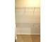 Walk-in closet with a carpeted floor and white wire shelving at 333 W Trade St # 505, Charlotte, NC 28202