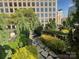 Lush rooftop garden with winding stone path, providing a tranquil escape amidst the bustling city at 333 W Trade St # 505, Charlotte, NC 28202