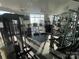 Bright gym featuring modern equipment, fans, and large windows with city views for an energizing workout experience at 333 W Trade St # 505, Charlotte, NC 28202