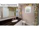 Bathroom featuring a single sink vanity with granite countertop and tile flooring at 4266 Sylvan Pond Ct, Denver, NC 28037