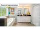 An elegant bathroom with double vanity, bathtub, and a bright window providing natural light at 4266 Sylvan Pond Ct, Denver, NC 28037
