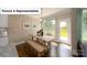 Open dining area featuring a wooden table, benches and a backyard door at 4266 Sylvan Pond Ct, Denver, NC 28037