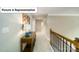Hallway with carpet, neutral paint, and railing to the lower level at 4266 Sylvan Pond Ct, Denver, NC 28037
