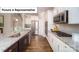 Modern kitchen showcasing stainless steel appliances, granite countertops, white cabinets, and hardwood floors at 4266 Sylvan Pond Ct, Denver, NC 28037