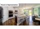 Modern kitchen features stainless appliances, granite countertops, and island seating at 4266 Sylvan Pond Ct, Denver, NC 28037
