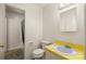 Clean bathroom with a white toilet, sink with yellow countertop and shower/tub at 4333 Dunwoody Dr, Charlotte, NC 28215