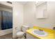 Bright bathroom featuring a yellow countertop, neutral walls and patterned shower curtain at 4333 Dunwoody Dr, Charlotte, NC 28215