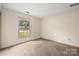 Neutral bedroom with carpet and a window offering views of the outdoors at 4333 Dunwoody Dr, Charlotte, NC 28215