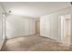 Spacious bedroom with neutral walls, carpet flooring and access to other rooms at 4333 Dunwoody Dr, Charlotte, NC 28215