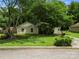 Charming single-story home with lush front lawn and mature trees creating a serene setting at 4333 Dunwoody Dr, Charlotte, NC 28215