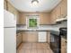 The kitchen has tile floors, updated countertops, modern appliances, a window, and ample cabinet space at 4333 Dunwoody Dr, Charlotte, NC 28215