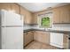 The kitchen has tile floors, updated countertops, modern appliances, a window, and ample cabinet space at 4333 Dunwoody Dr, Charlotte, NC 28215