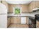 The kitchen has tile floors, updated countertops, modern appliances, a window, and ample cabinet space at 4333 Dunwoody Dr, Charlotte, NC 28215