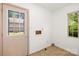 The laundry room has tile floors, a window for natural light and a door that leads to the backyard at 4333 Dunwoody Dr, Charlotte, NC 28215