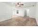 This living room features neutral carpet, and an adjacent dining area making this a great place to relax and unwind at 4333 Dunwoody Dr, Charlotte, NC 28215