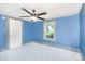 Bedroom with blue walls, carpet, and a window showing outdoor plants at 439 Neisler Rd, Concord, NC 28025