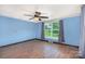 Bedroom featuring blue walls, wood flooring, and natural light at 439 Neisler Rd, Concord, NC 28025