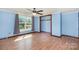 Comfortable bedroom with large windows and an empty closet at 439 Neisler Rd, Concord, NC 28025