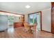 Inviting dining area featuring natural wood table and chairs, plus access to kitchen at 439 Neisler Rd, Concord, NC 28025