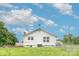 Back side of the white home, featuring a weather vane on the roof at 439 Neisler Rd, Concord, NC 28025
