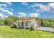 Cozy one-story house with a red roof, front porch, and mature landscaping at 439 Neisler Rd, Concord, NC 28025