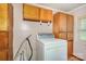 Convenient laundry room with storage cabinets and a washing machine at 439 Neisler Rd, Concord, NC 28025