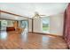 Spacious living area with wood floors, ceiling fan, and view into the kitchen at 439 Neisler Rd, Concord, NC 28025