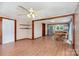 Open-concept living area with wood-look floors, neutral walls, and ceiling fan at 439 Neisler Rd, Concord, NC 28025