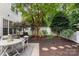 Serene backyard showcasing a patio set and lush landscaping at 4442 Coventry Row Ct, Charlotte, NC 28270