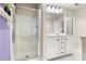 Bathroom featuring a shower, vanity, and bright lighting fixtures at 4442 Coventry Row Ct, Charlotte, NC 28270