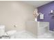 Well-lit bathroom featuring a toilet, bathtub, and neutral decor at 4442 Coventry Row Ct, Charlotte, NC 28270